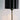 Detail of fluted black shade on antique gold wall lamp.