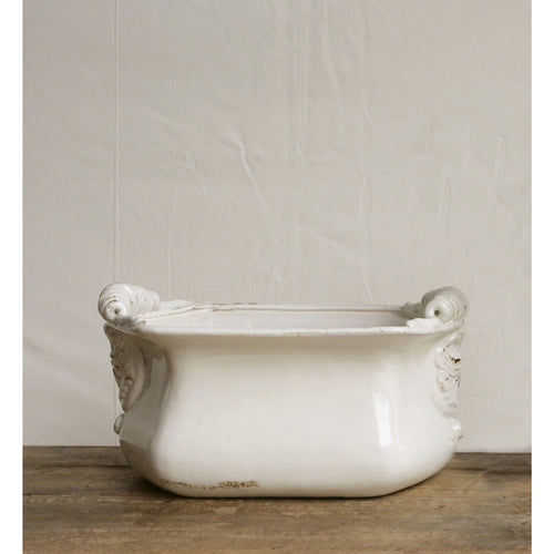 White decorative bowl inspired by antiques. 