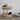 Woven wicker tiered tray in kitchen for fruit storage on countertop.