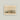 Unframed artwork of horses running on a plain with mountains in the background.