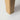 Close-up of solid oak leg showcasing the natural wood grain.