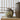 The Makou Ginger Jar sitting on a natural rustic wood table next to a taller dark brown stoneware vase.