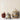 Stoneware acorn canisters on table with a jar of honey.