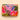 The large velvet quilted Whimsical Woodland featuring an adorable rabbit looking towards bright coloured flowers and foliage. A pink background with lots of vibrant colours.
