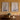 Set of Wood Framed Sailboat Prints Under Glass mounted side by side on a mustard coloured, plastered wall.