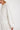 White long-sleeve top worn by a person on a white background.