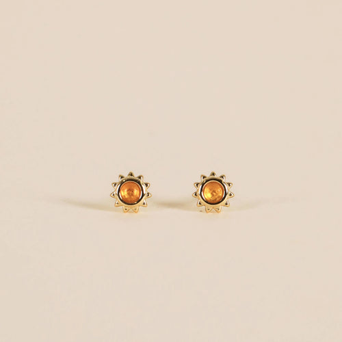 Gold plated sun studs with an amber stone in the center. 