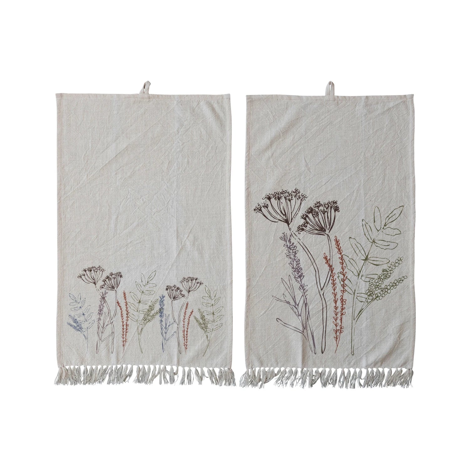 Cotton printed kitchen towel with assorted flowers and fringe.
