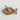 Hand-carved wooden fish-shaped dish made from natural mango wood, holding a small bundle of dried sage wrapped in twine. The dish sits on a textured white surface, creating a rustic and earthy aesthetic.
