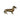 Side view of an antique brass dachshund figurine with a patina finish, standing on four legs.