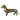 Side view of an antique brass dachshund figurine with a patina finish, standing on four legs.