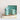 Aqua colored stoneware creamer styled with matching mugs and a platter.
