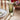 Mossy green coloured drinkware on a tablescape filled with fresh flowers and candles.
