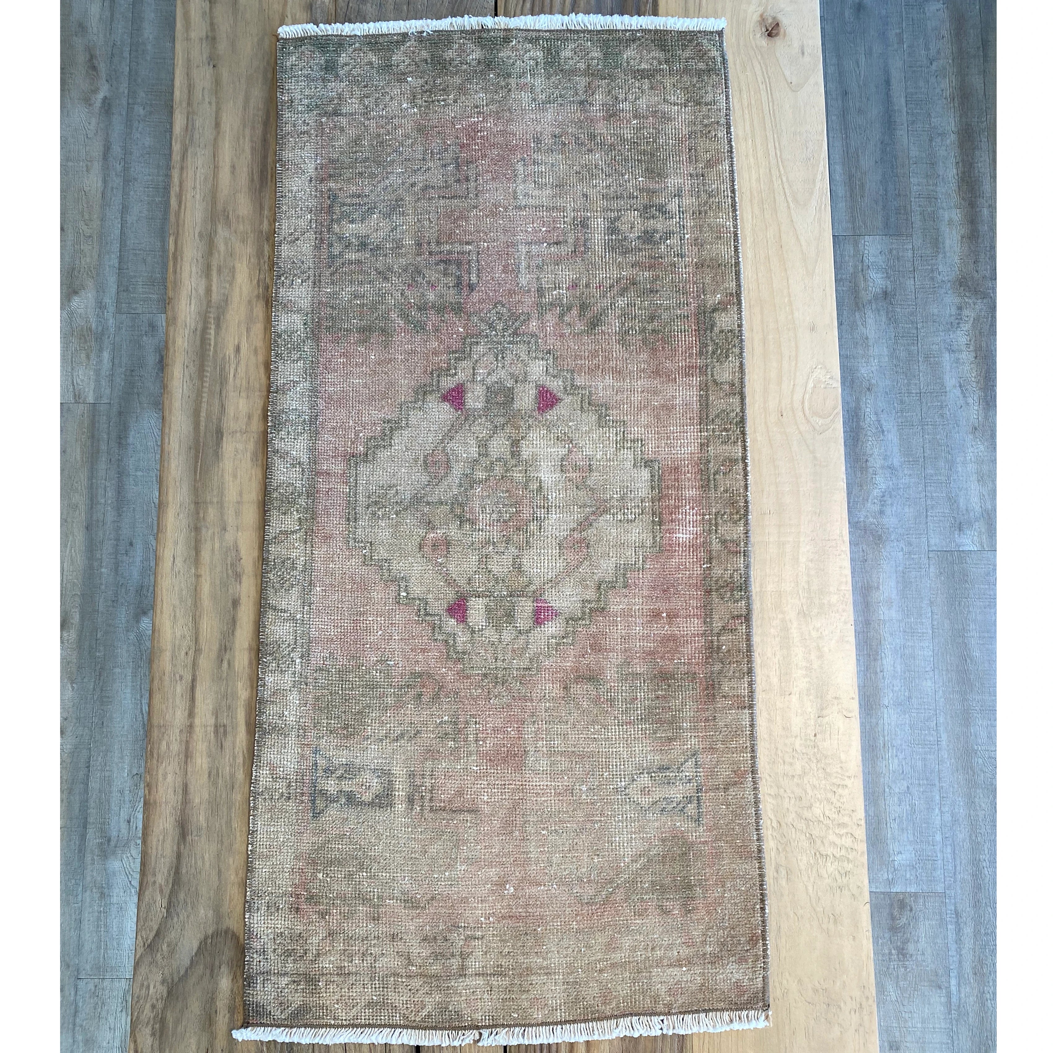 Turkish rug with Pale green, pale pink and beige with hints of hot pink