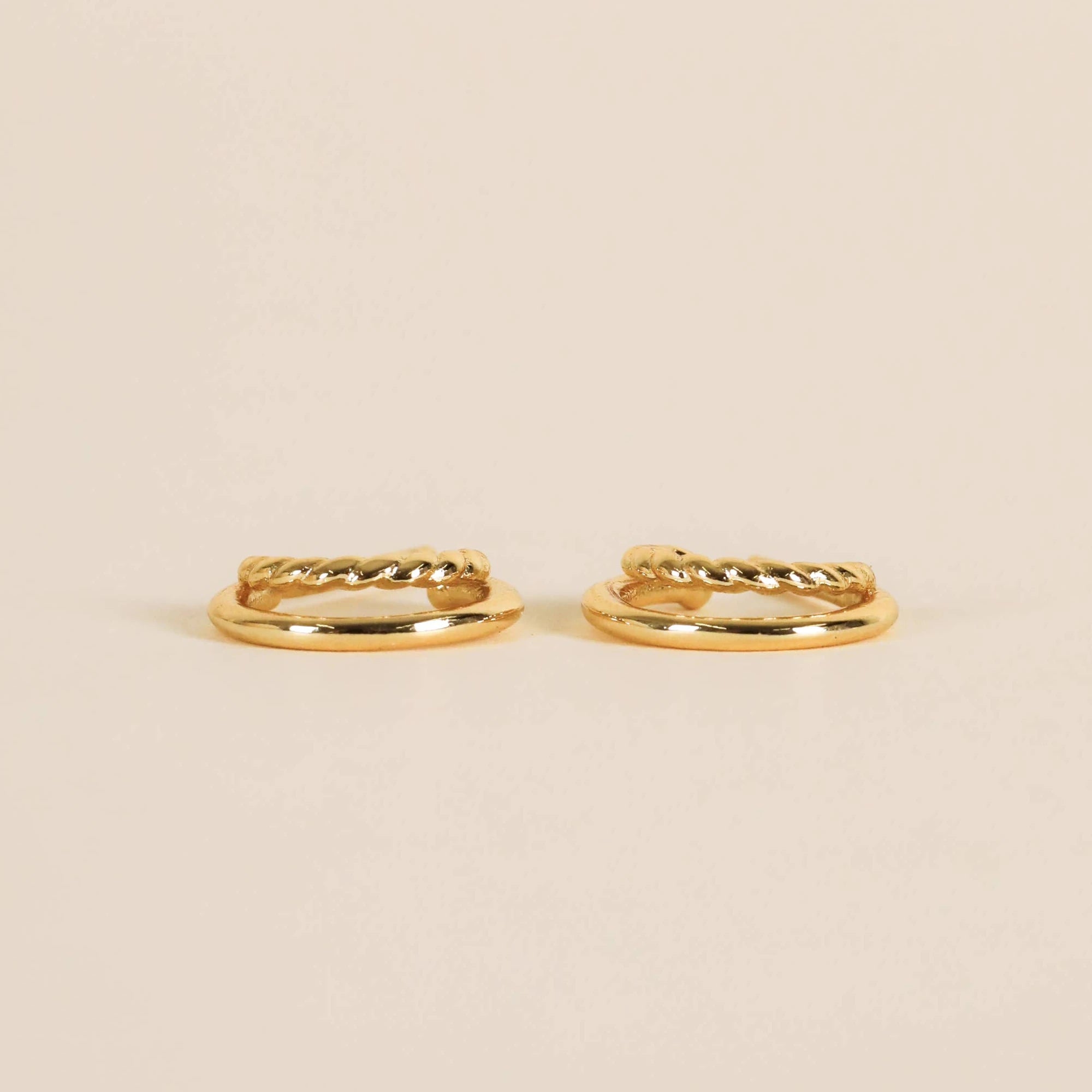 Side view of gold double hoop earrings.