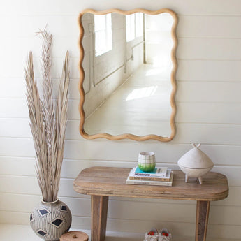 Wooden Squiggle Framed Mirror with table and planters.