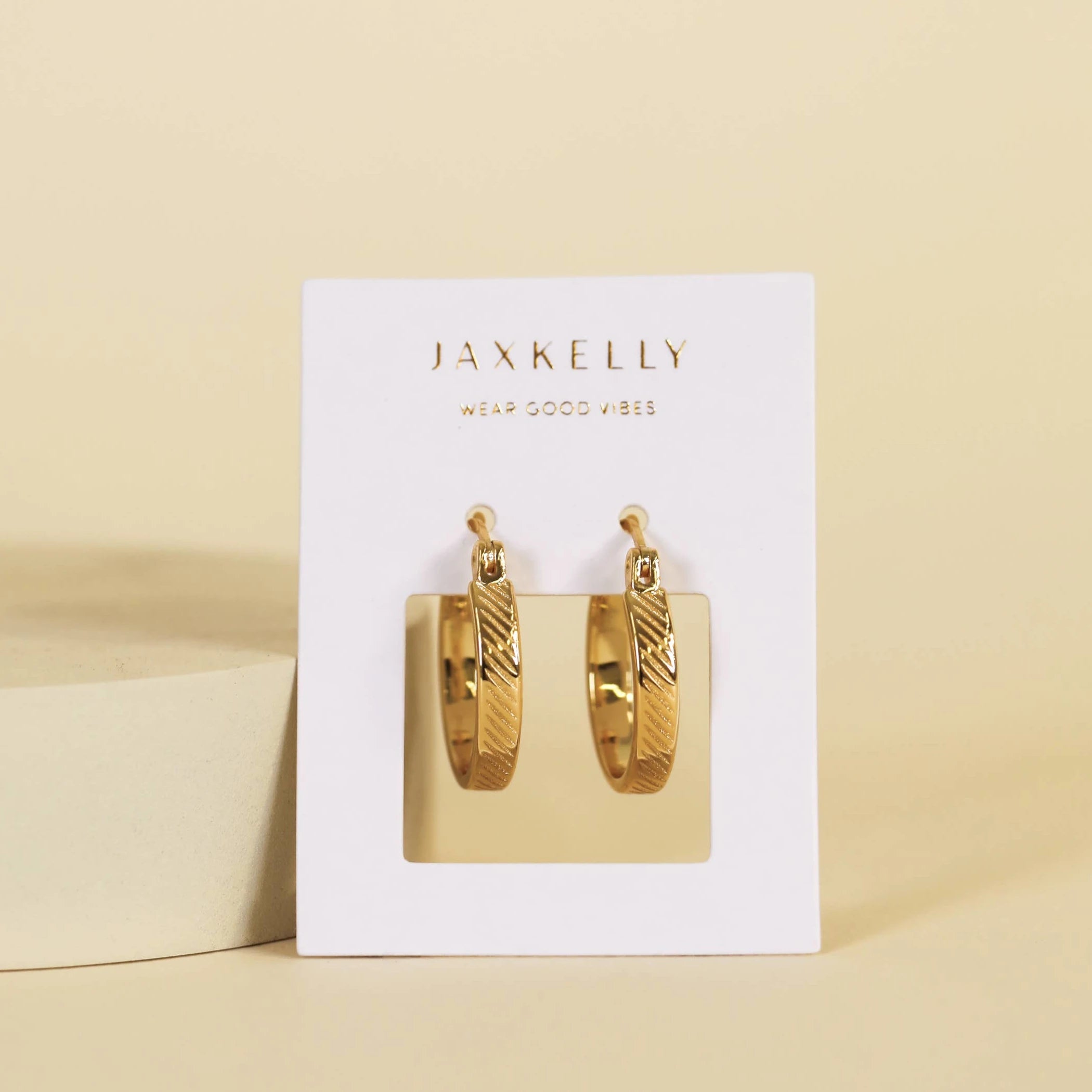 JaxKelly textured gold plated hoop earrings. 