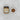 Jar of sea salt caramel sauce with a small bowl of the sauce on a textured white surface
