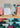 Collection of colorful affirmation cards on a wooden stand with a neutral background
