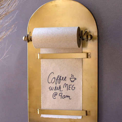 Antique Brass Magnetic Note Roll with a handwritten note. 