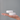 Shower steamers on a person's palm against a gray background
