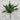 Artificial Christmas tree against a brick wall background