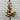 Artificial lemon leaf branch against a white brick wall