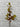 Artificial lemon leaf branch against a white brick wall