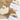 Two bars of Canadian Maple Soap on a wooden surface with a white background.