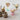 Ice cream dishes with caramel sauce on a light surface