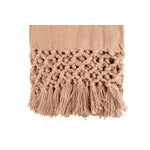 The beautiful crochet and fringe detail on the woven cotton throw. 