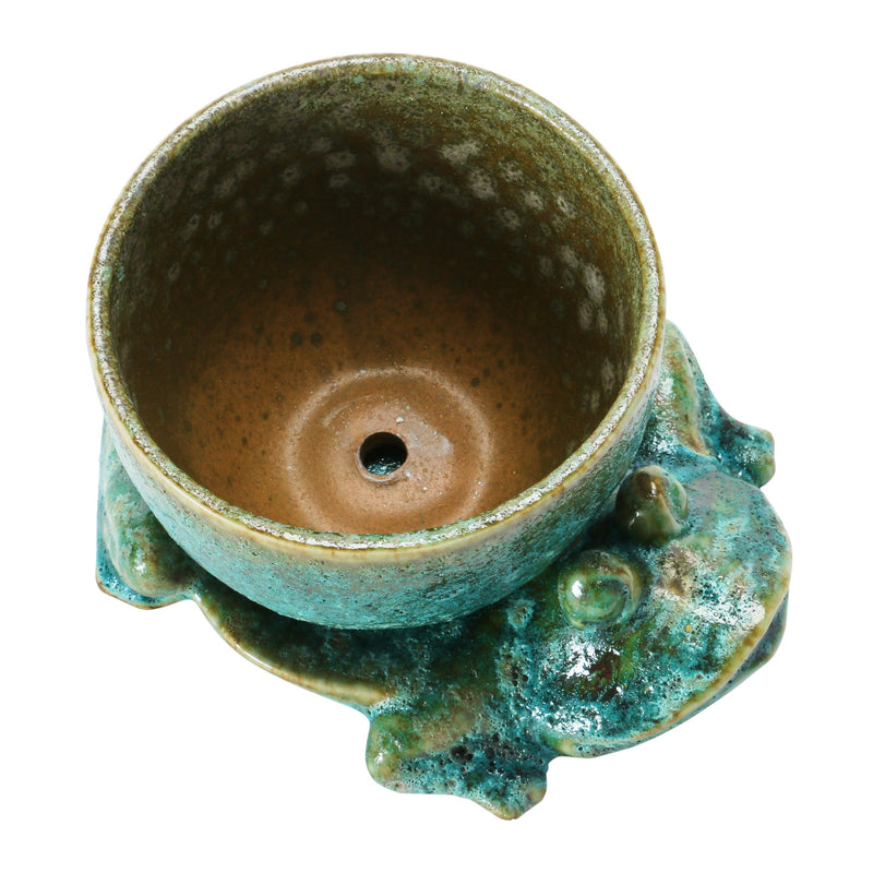 Stoneware Planter with Frog Base has a drainage hole allowing you to plant directly in the planter. 