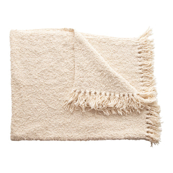 A Cozy Cotton Blend Boucle Throw with Fringe detail in a neutral off-white. 
