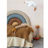 Childs bedroom featuring the Ctton Knit Plush Snake with Stripes and soft cozy bedding. 