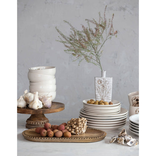 Mango Wood Pedestal styled with matching tray, stoneware plates and bowls stacked and a beautiful vase. 