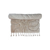 New Zealand Wool & Cotton Tufted Rug rolled up showing tassel details. 