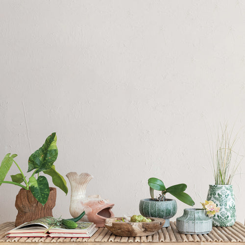 The Botanist collection featuring the Embossed Footed Vase / Planter in green. 