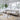 Modern living room with a sectional sofa, coffee table, and decorative items.