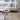 Living room with a gray sofa, wooden coffee table, and decorative items.