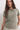 Woman wearing a green t-shirt against a white background