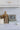 Decorative items on a kitchen counter including a framed picture, books, and a small tree sculpture.