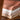 Stack of folded Turkish hand Towels in various colors on a wooden surface