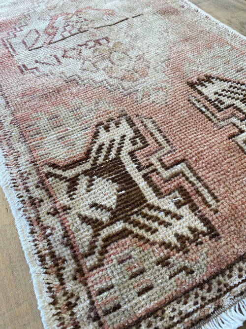 Close up details of the pink ombré rug showing the unique design. 