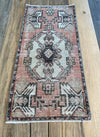 Turkish area rug in earthy Pink with brown, beige and hints of blue gray.