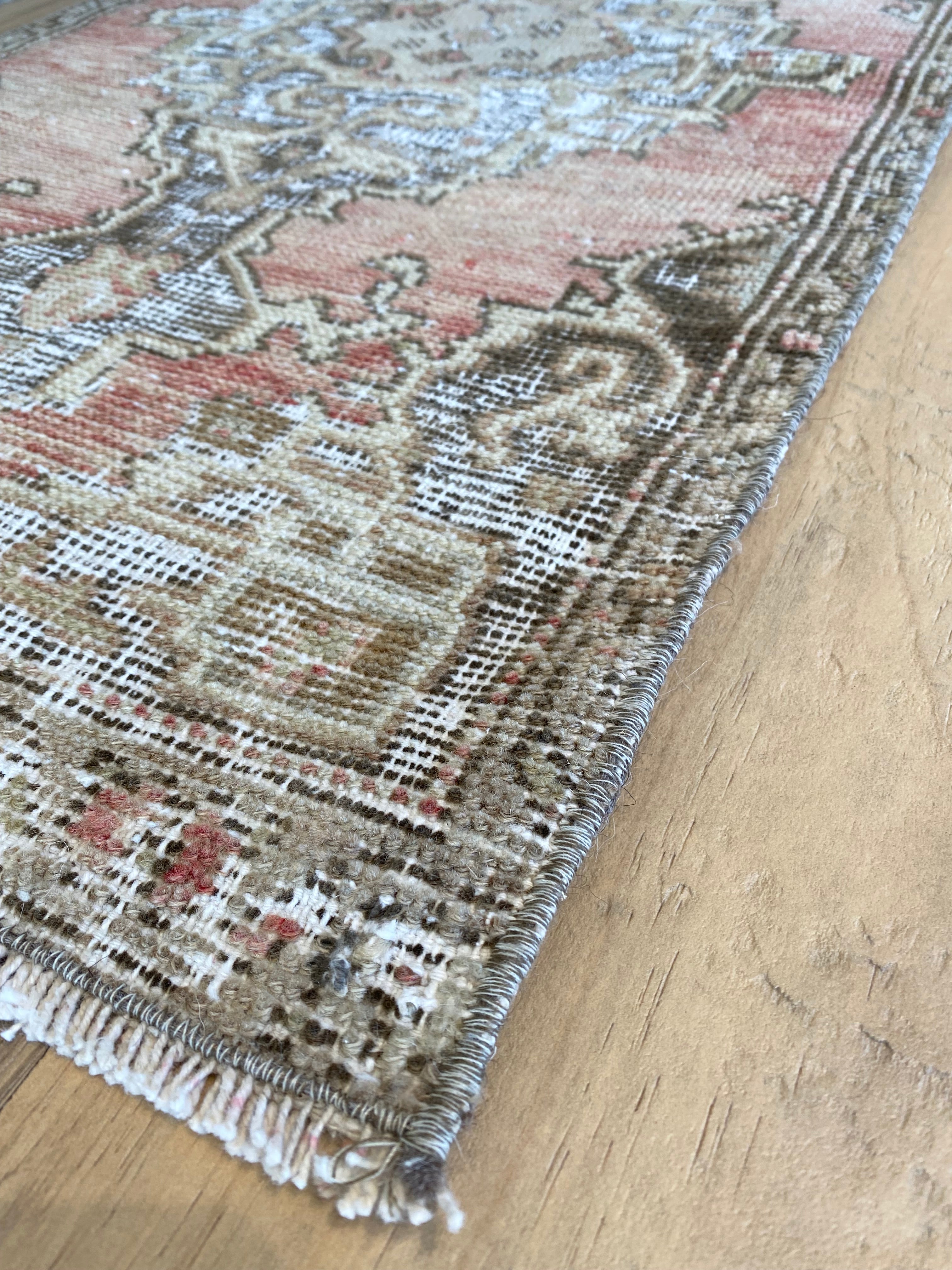 Corner details of the Turkish rug with fringe detail. 