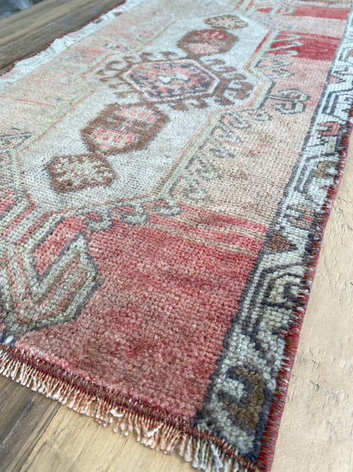 Repurposed vintage Turkish rug with shades of pink and brown. 
