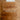Two wooden cutting boards on a wooden surface with patterned paper underneath.