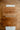Two wooden cutting boards on a wooden surface with patterned paper underneath.