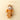 Plush toy mouse in a brown outfit with a scarf and knitting needles on a beige background