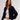 Woman wearing a navy blue cardigan over a white top on a plain background.